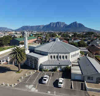 Aerial view of MountView Mosque with Table Mountain in the background